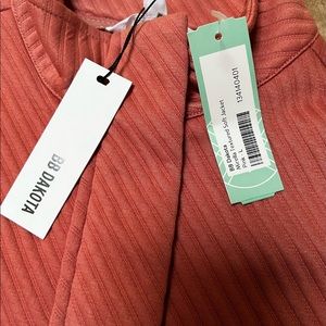 Stylish soft peach jacket.